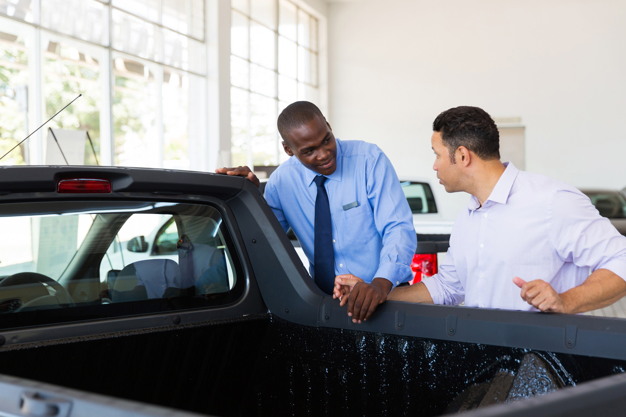 Person Checking a Truck For Sale